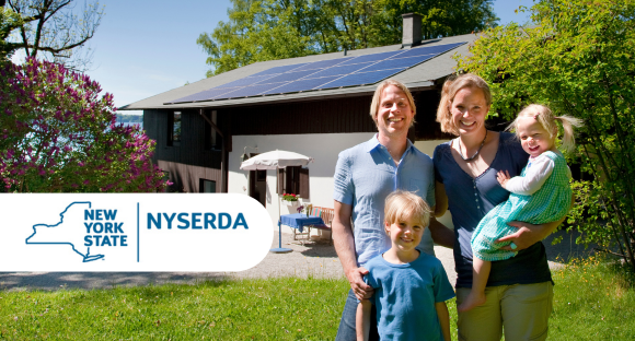 Family photo with house featuring solar panels in background. Advertising NYSERDA