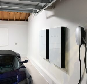 car in garage with Tesla system