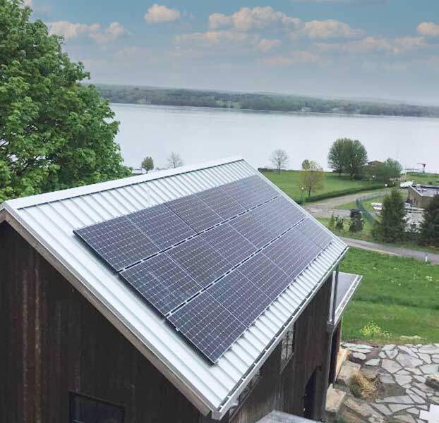 roof with solar panels near lake